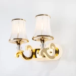 وحدة إضاءة جداريّة ديكورية، طول 27 سم، العمق 24 سم، لون ذهبي وأبيض